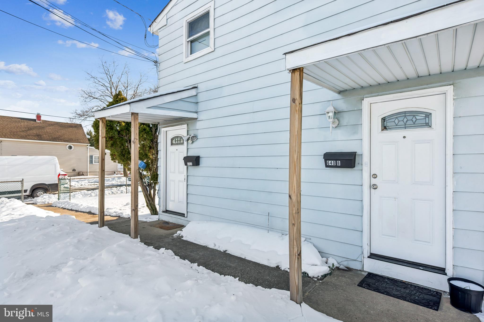 640 Bem Street Riverside, NJ 08075 - Photo 14 of 26 a view of a porch with a table and chairs and potted plants