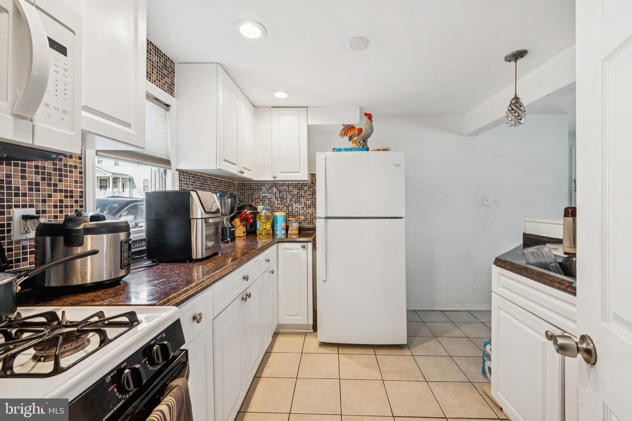 640 Bem Street Riverside, NJ 08075 - Photo 19 of 26 a kitchen with refrigerator a stove and a refrigerator