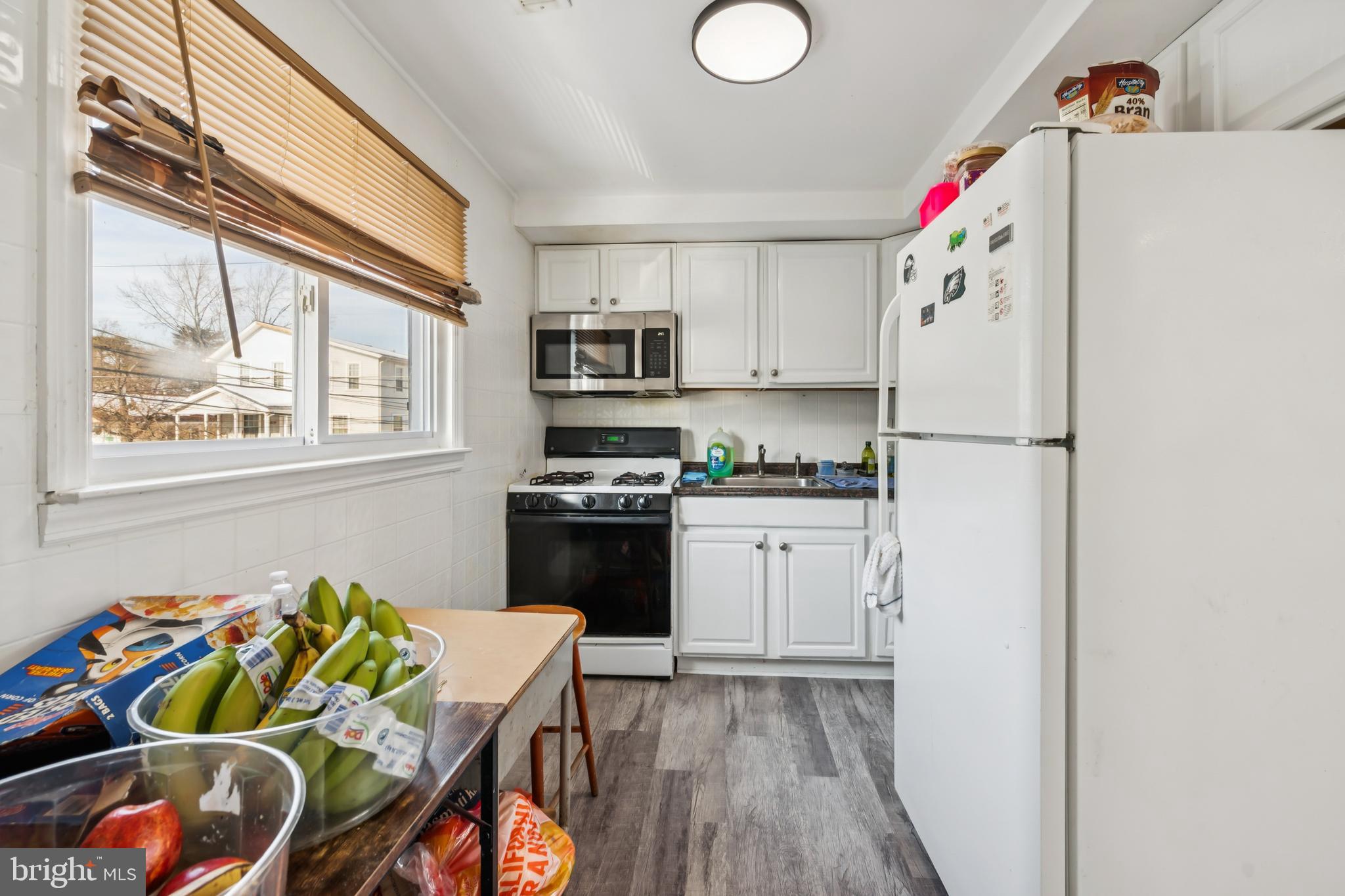 640 Bem Street Riverside, NJ 08075 - Photo 21 of 26 a kitchen with stainless steel appliances granite countertop a refrigerator sink and white cabinets