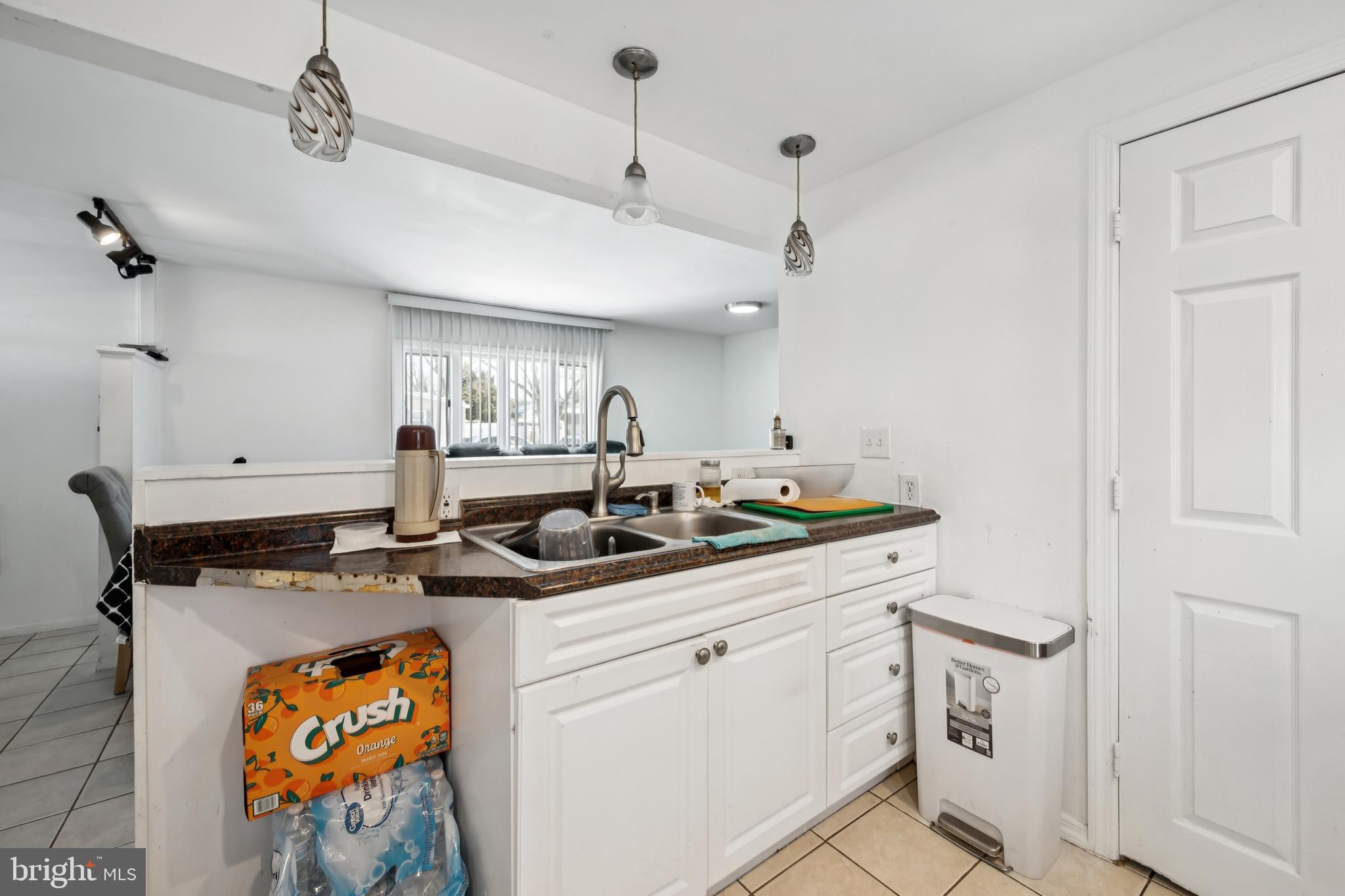 640 Bem Street Riverside, NJ 08075 - Photo 9 of 26 a kitchen with stainless steel appliances granite countertop a sink and cabinets