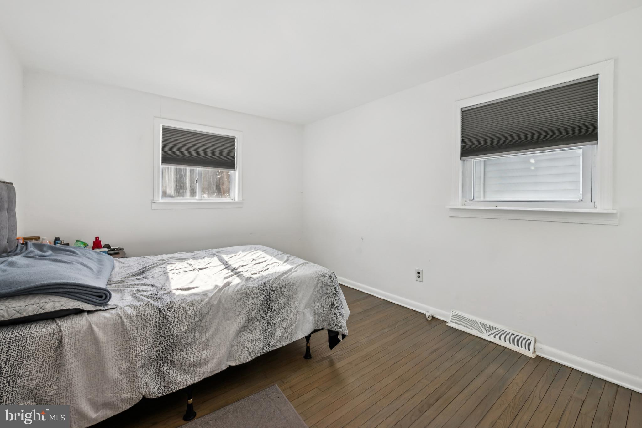 640 Bem Street Riverside, NJ 08075 - Photo 10 of 26 a bedroom with a bed and a flat screen tv