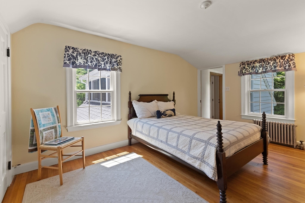 19 Pine Hill Circle Wakefield, MA 01880 - Photo 21 of 31 a large bed sitting in a bedroom next to a window