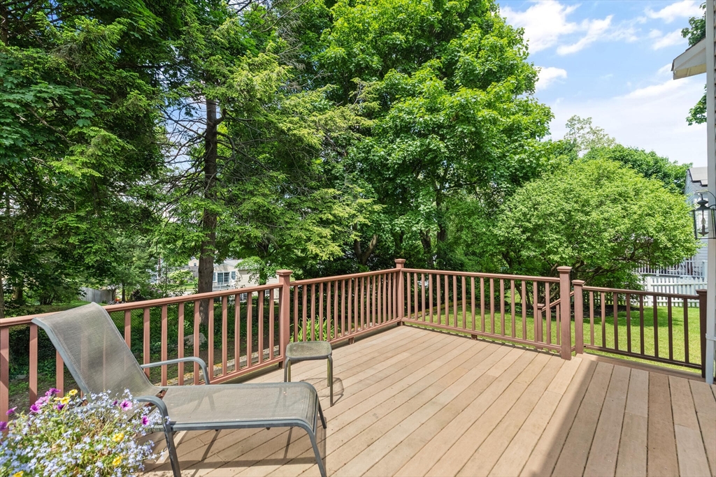 19 Pine Hill Circle Wakefield, MA 01880 - Photo 29 of 31 a view of a wooden deck with a patio