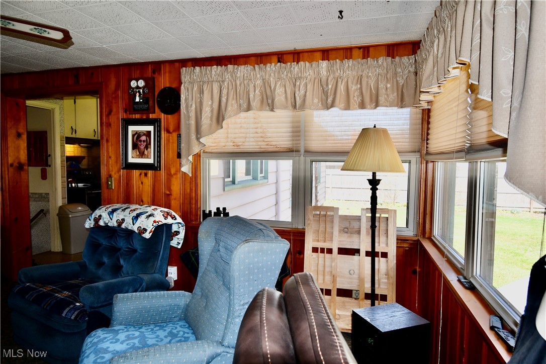 4659 Canfield Road Canfield, OH 44406 - Photo 14 of 34 Living area with wood walls