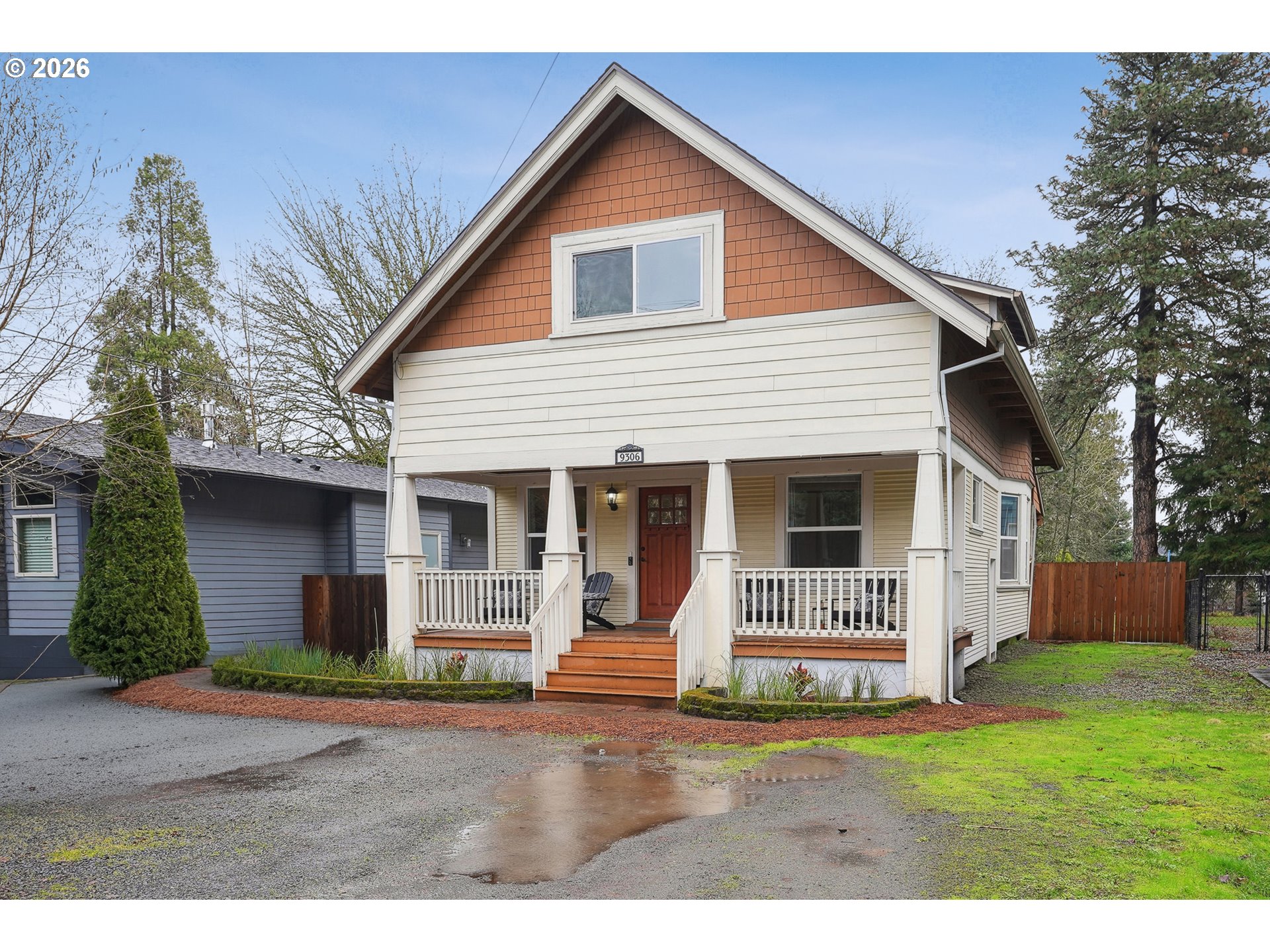9306 Southwest 30th Avenue Portland, OR 97219 - Photo 1 of 30 a view of a house with a yard and garage