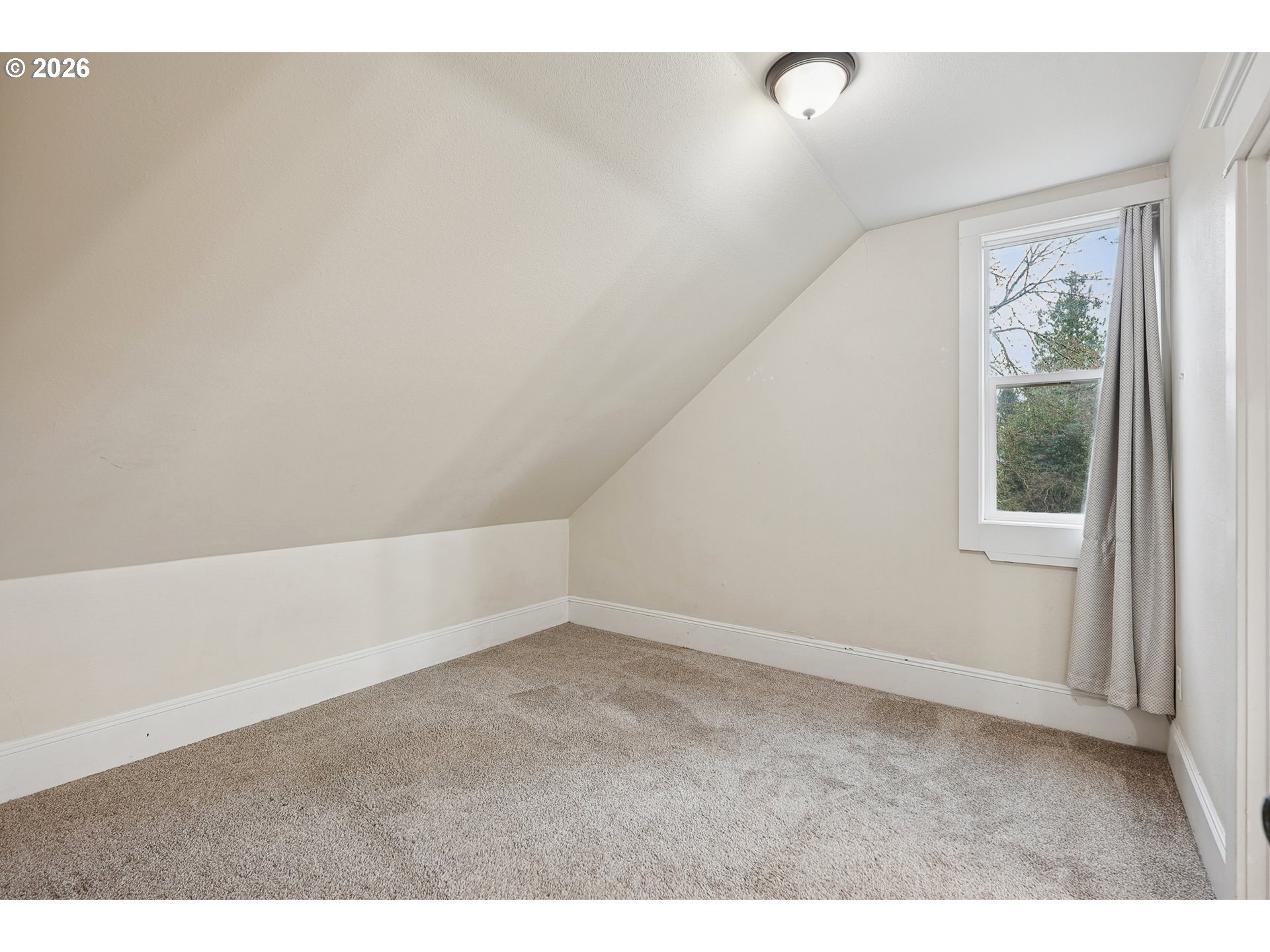 9306 Southwest 30th Avenue Portland, OR 97219 - Photo 17 of 30 a view of an empty room with a window