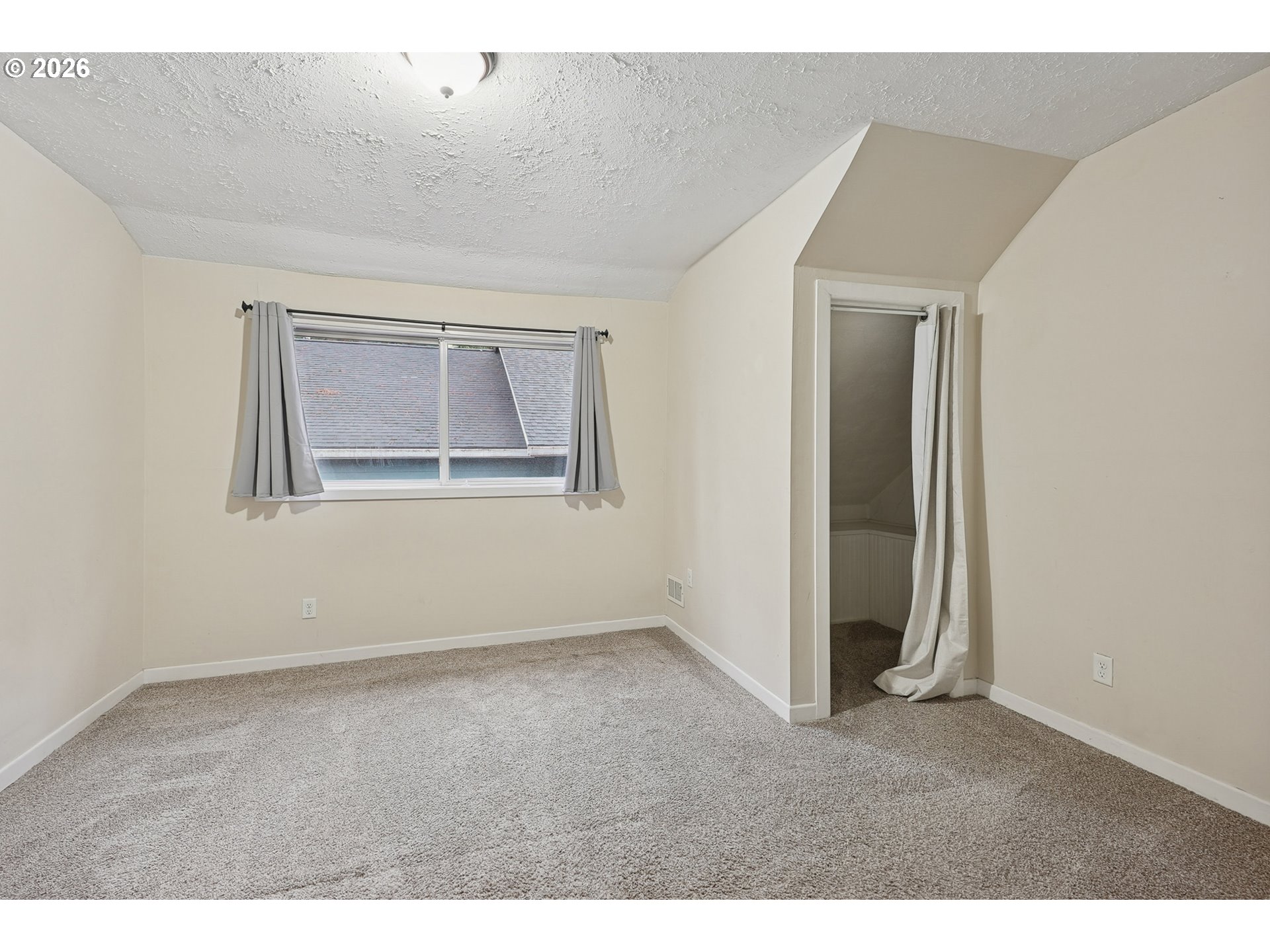 9306 Southwest 30th Avenue Portland, OR 97219 - Photo 19 of 30 a view of an empty room with a window