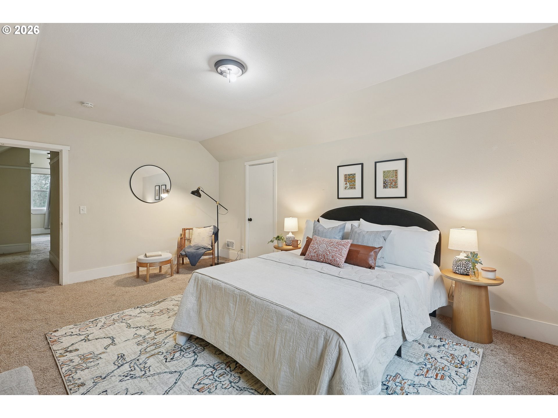 9306 Southwest 30th Avenue Portland, OR 97219 - Photo 21 of 30 a bedroom with a bed and a lamp