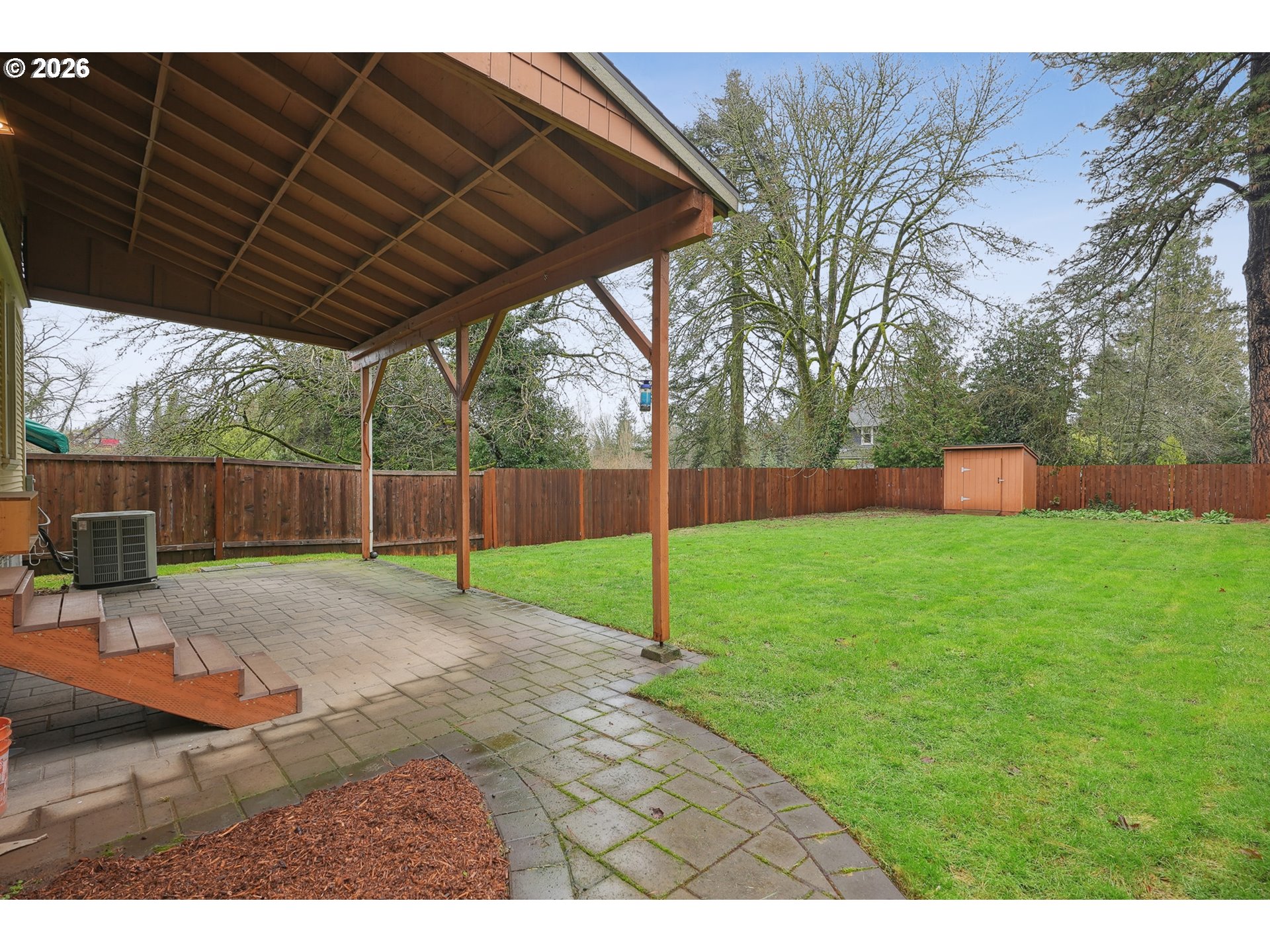 9306 Southwest 30th Avenue Portland, OR 97219 - Photo 27 of 30 a view of a backyard with wooden fence