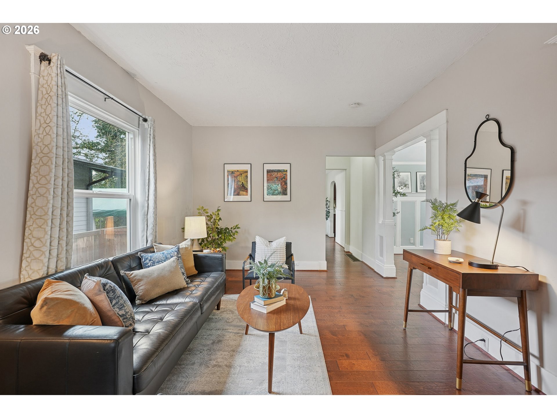 9306 Southwest 30th Avenue Portland, OR 97219 - Photo 5 of 30 a living room with furniture a window and a dining table