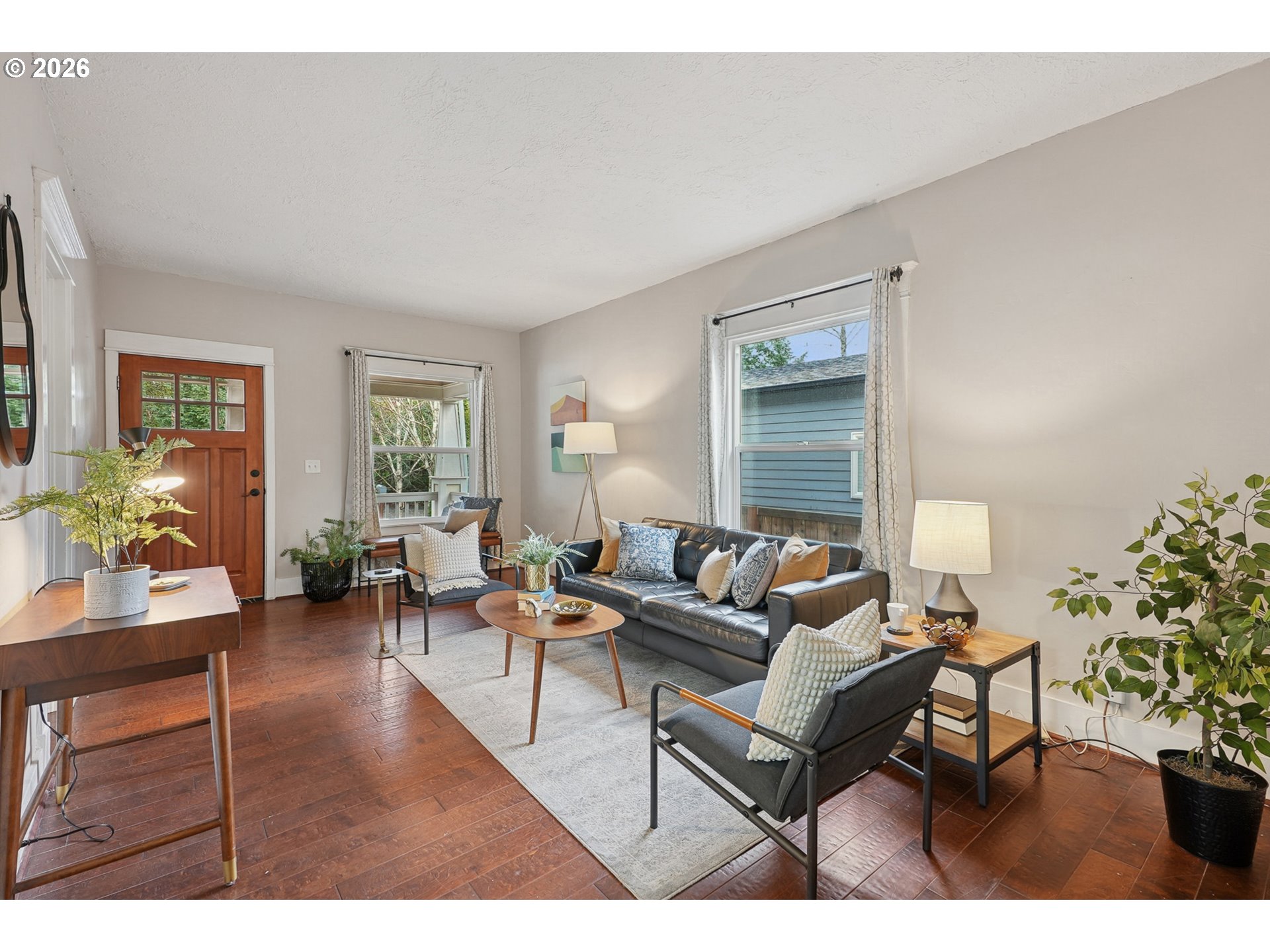 9306 Southwest 30th Avenue Portland, OR 97219 - Photo 6 of 30 a living room with furniture a dining table and a potted plant