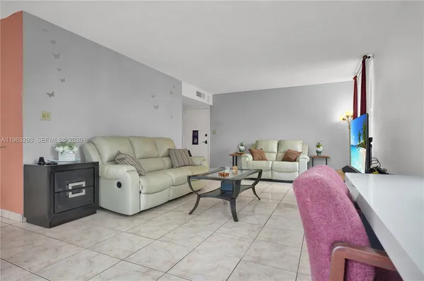 a kitchen with stainless steel appliances granite countertop a refrigerator and a stove