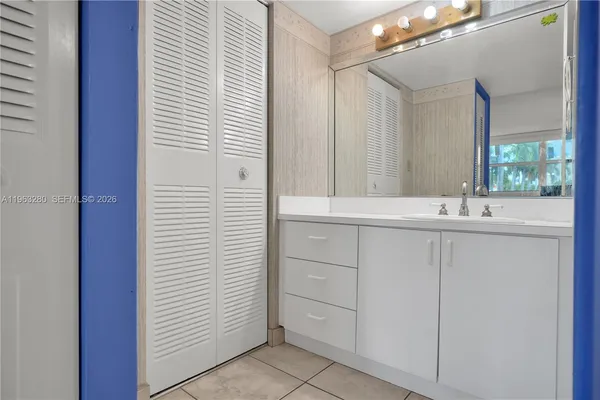 a bathroom with a white shower curtain