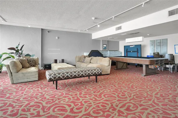 a view of swimming pool with chairs