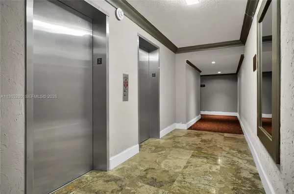 a living room with furniture a rug and a large window
