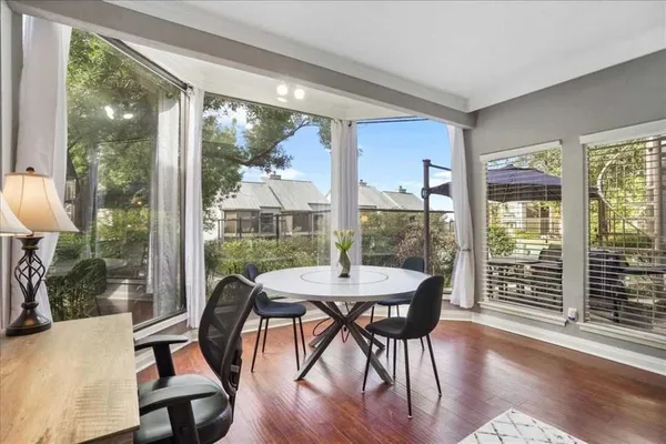 a view of a dining room with furniture window and wooden floor
