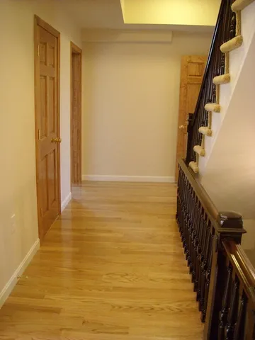 a view of an ocean from a hallway