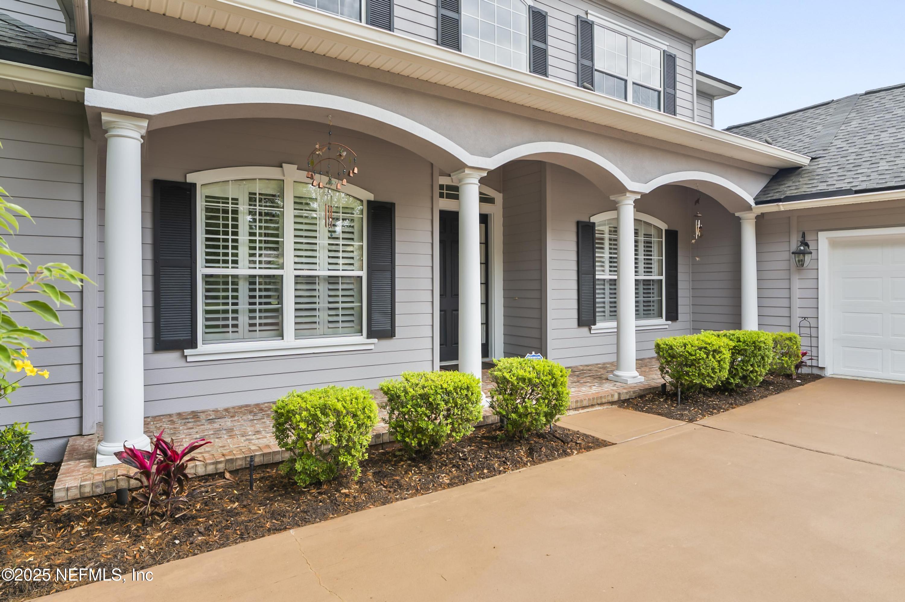 649 Treehouse Circle St. Augustine, FL 32095 - Photo 6 of 207 Brick floor front porch