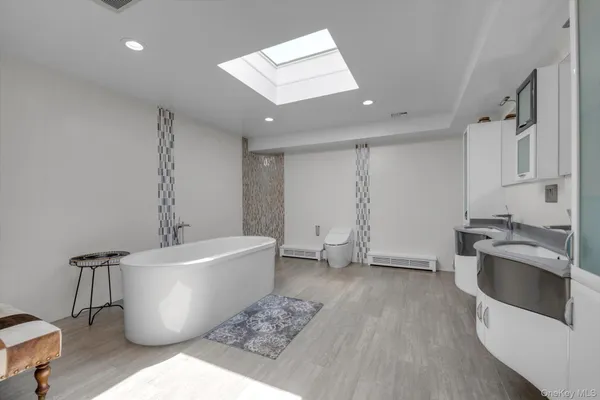 a large room with a couch and a stove top oven