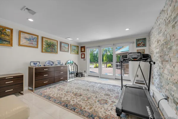 a view of a livingroom with furniture and a window