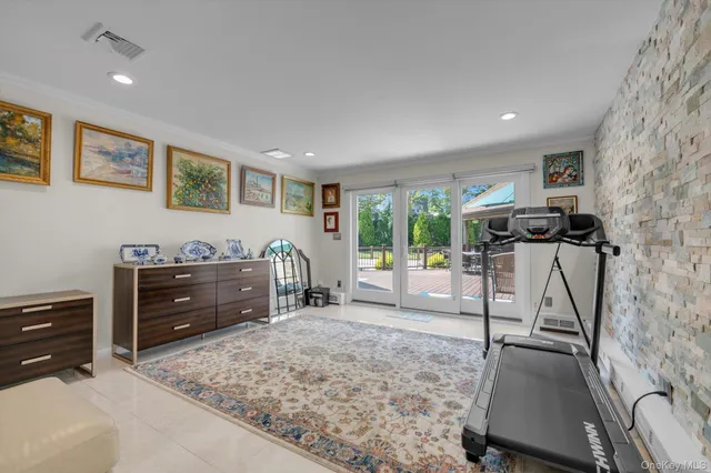 a view of a livingroom with furniture and a window