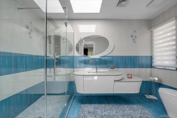 a bathroom with a sink and mirror