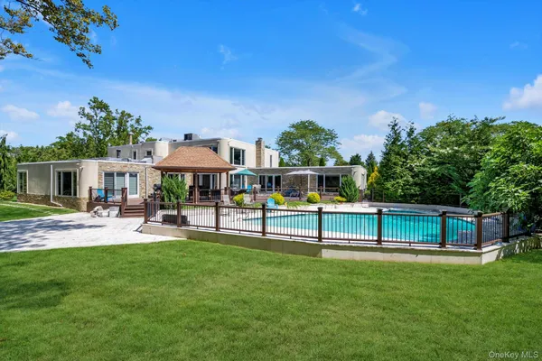 a view of a house with a yard porch and sitting area