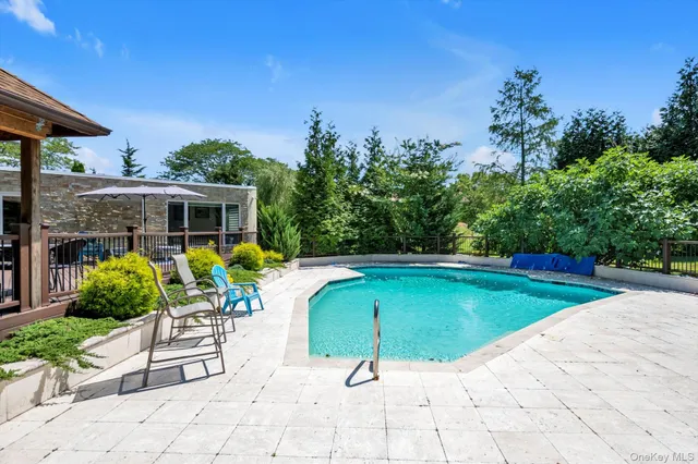 a view of a swimming pool with a patio