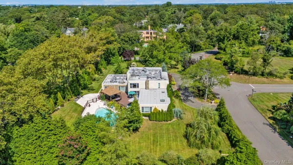 an aerial view of a house with a yard