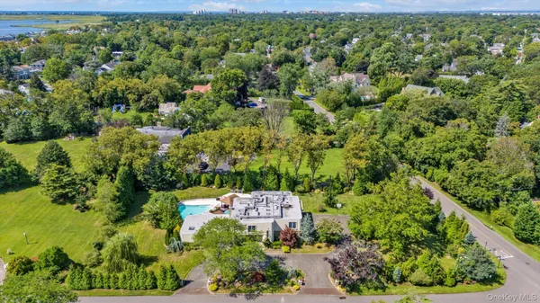an aerial view of a houses with a yard