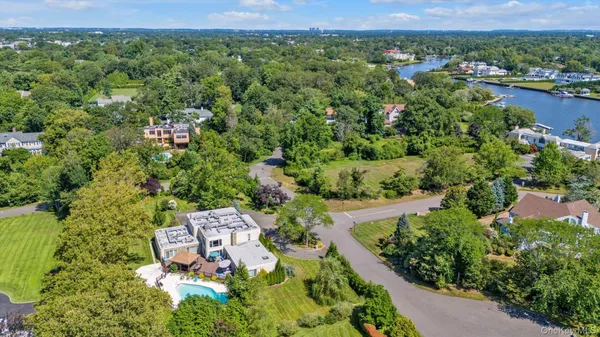 an aerial view of a house with a yard