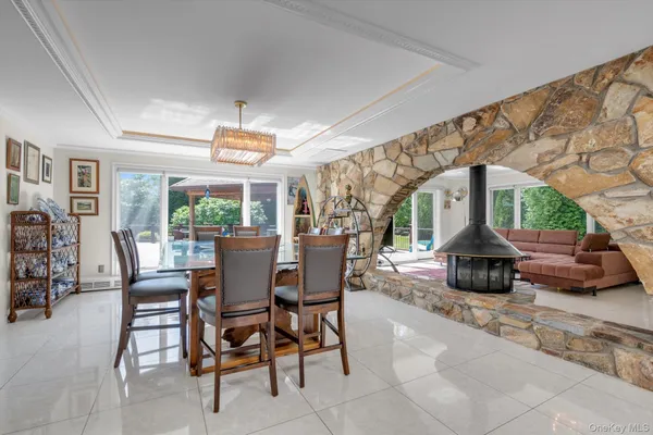 a view of a dining room with furniture window and outside view
