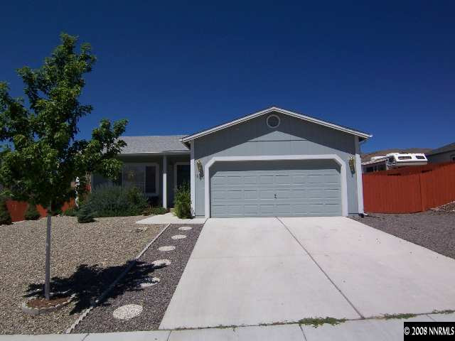 18031 Hazelnut Drive Reno, NV 89508 - Photo 1 of 9 a front view of a house with a yard