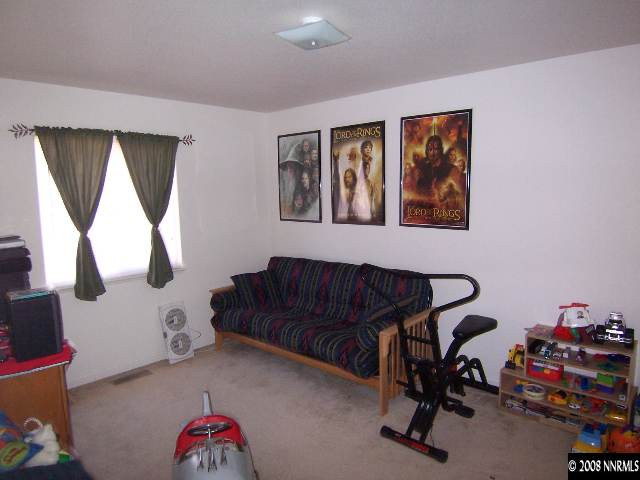 18031 Hazelnut Drive Reno, NV 89508 - Photo 6 of 9 a livingroom with window and a couch