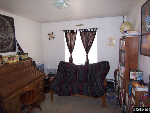 18031 Hazelnut Drive Reno, NV 89508 - Photo 7 of 9 a living room with furniture and a window