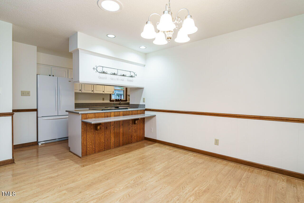 5917 Countryview Lane Raleigh, NC 27606 - Photo 8 of 43 This room is designed to bring people together, offering a warm and welcoming atmosphere for sharing meals and creating lasting memories with family and friends.