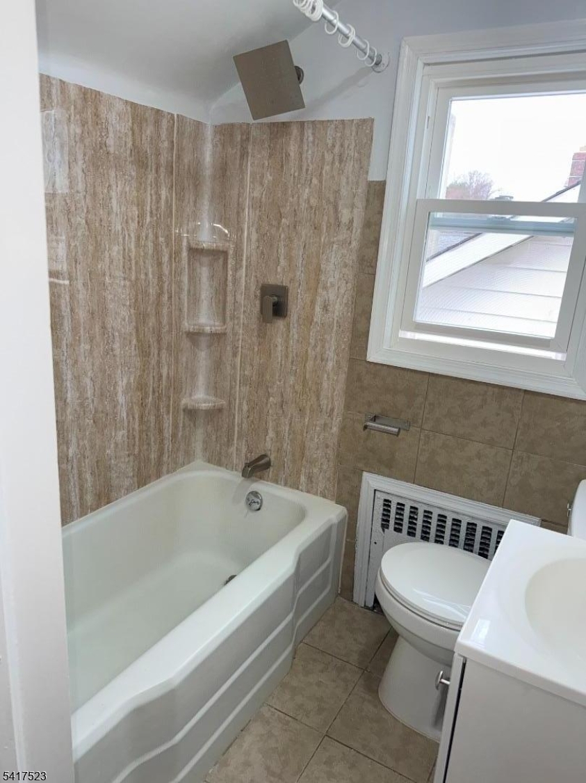 2021 Tyler Street Union, NJ 07083 - Photo 6 of 14 a bathroom with a sink and a bathtub