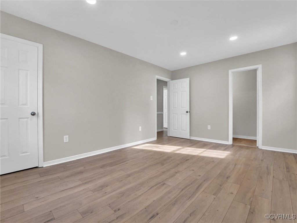 4716 Archduke Road Glen Allen, VA 23060 - Photo 21 of 33 Primary bedroom featuring light hardwood / wood-st