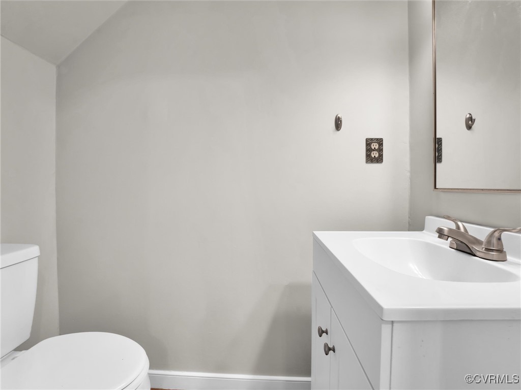 4716 Archduke Road Glen Allen, VA 23060 - Photo 26 of 33 Bathroom featuring toilet, vanity, and vaulted cei