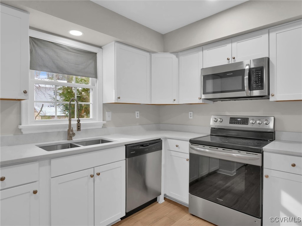 4716 Archduke Road Glen Allen, VA 23060 - Photo 6 of 33 Kitchen with white cabinetry, sink, and stainless