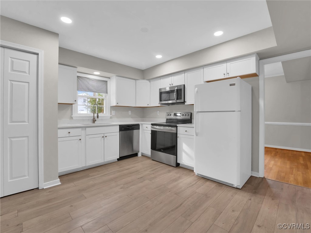 4716 Archduke Road Glen Allen, VA 23060 - Photo 7 of 33 Kitchen featuring white cabinets, LVP flooring, si