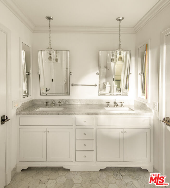 5549 Green Oak Drive Los Angeles, CA 90068 - Photo 17 of 26 a bathroom with a sink and a mirror