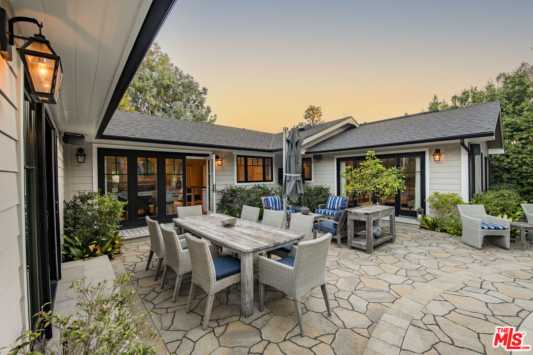 5549 Green Oak Drive Los Angeles, CA 90068 - Photo 19 of 26 a view of a house with backyard sitting area and garden
