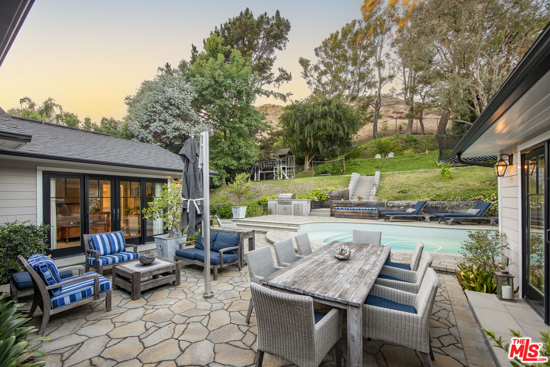 5549 Green Oak Drive Los Angeles, CA 90068 - Photo 20 of 26 a outdoor space with patio couch and a fire pit