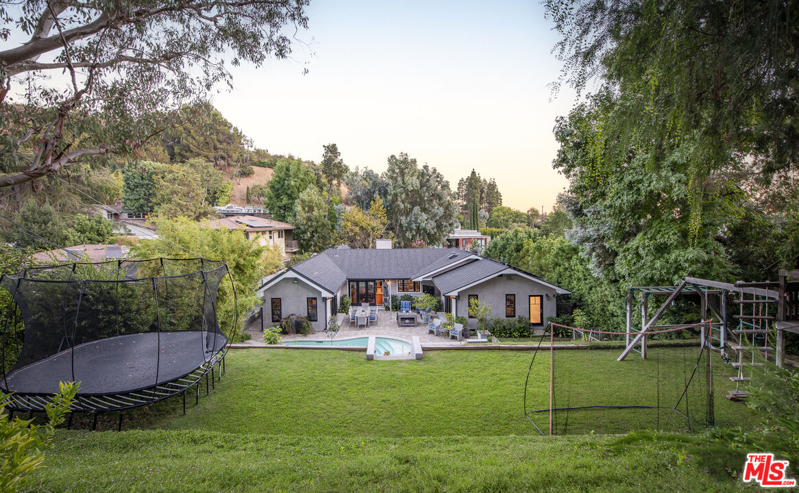5549 Green Oak Drive Los Angeles, CA 90068 - Photo 26 of 26 a front view of a house with garden