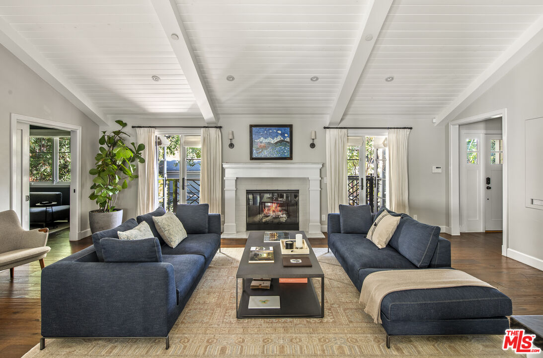 5549 Green Oak Drive Los Angeles, CA 90068 - Photo 6 of 26 a living room with furniture and a fireplace