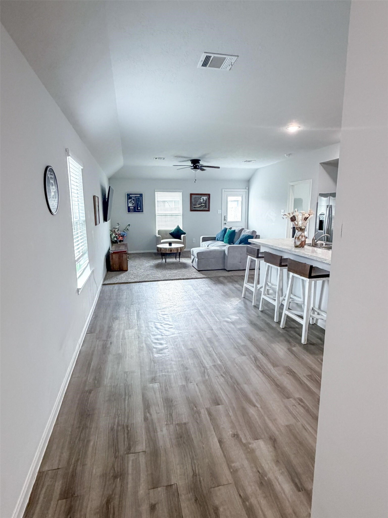 1513 22nd Street Hempstead, TX 77445 - Photo 2 of 12 a living room with furniture and a wooden floor