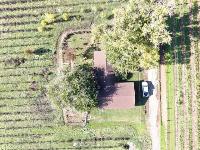 a view of a house with wooden fence
