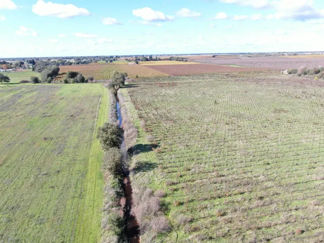 a view of a lake with a yard