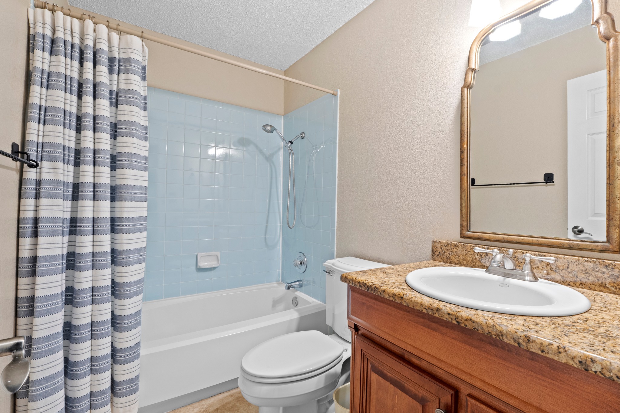 701 Berry Lane Georgetown, TX 78626 - Photo 31 of 37 Guest bathroom very retro feel with the pretty midcentury modern tile